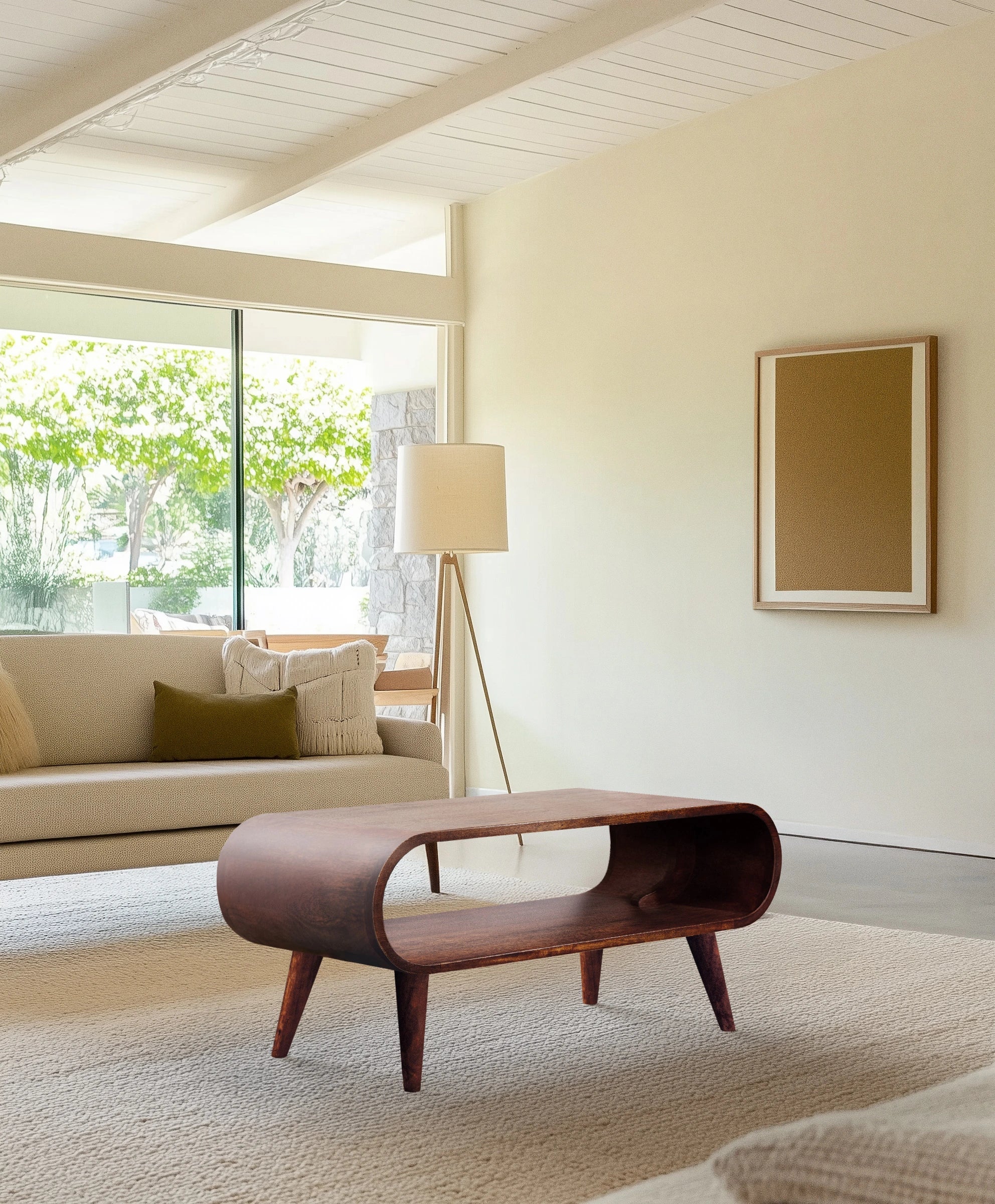 Oval wooden center table with organic materials